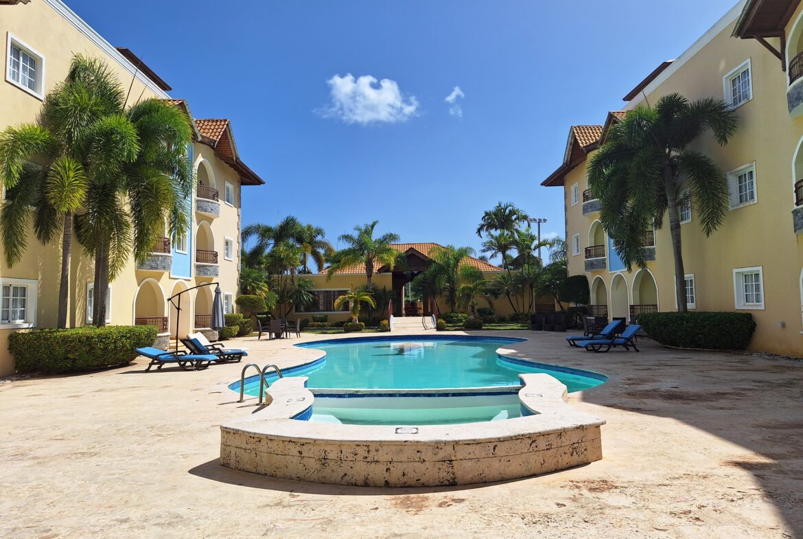 Pool between buildings.